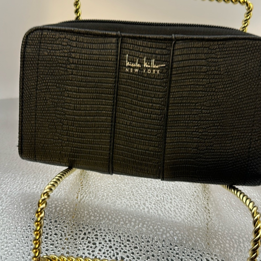 Nicole Miller wallet. Black with a beautiful texture to it. Gently used.​​